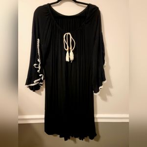 LIKE New Unique Black dress with ruffle sleeves. Can be worn off the shoulder.